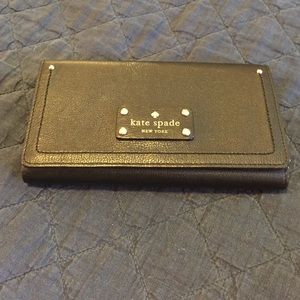 Black kate spade fold out wallet.
