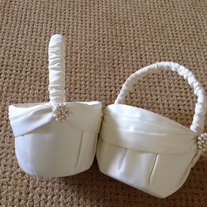 1 of 2 ivory satin flower girl baskets.