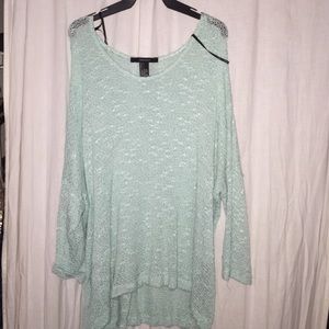 A teal quarter length sleeve sweater