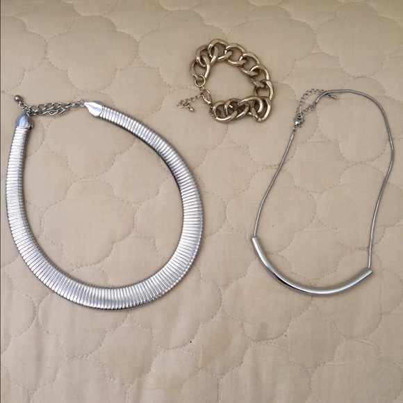 2 silver necklaces and 1 gold bracelet