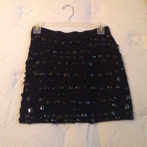 Black bejeweled mini skirt