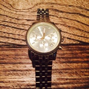 Used gold Michael Kors watch.