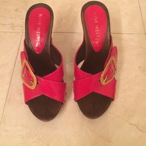 Hot cherry red high heeled slip ons.