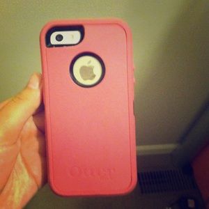 Pink and black otter box defender case