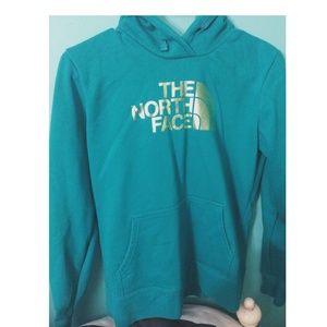 teal north face hoodie with gold letters