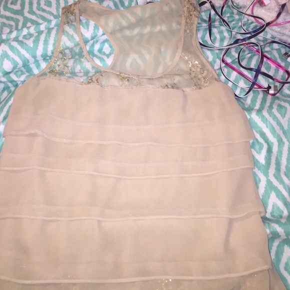 Beige raceback tank top.