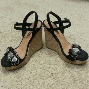 Black Jeweled wedge sandals.