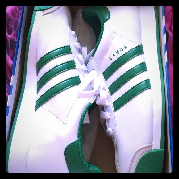 White & green Adidas samoas