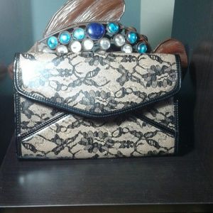 Lace patterned envelope clutch