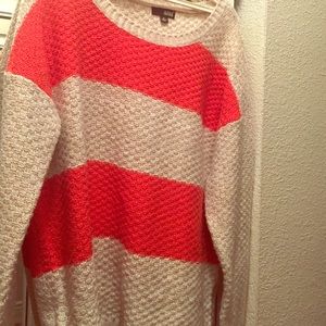 Orange and creme colored sweater