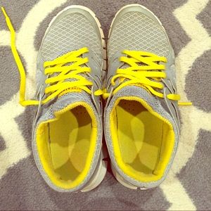 Grey and yellow Nike Free Tennis shoes