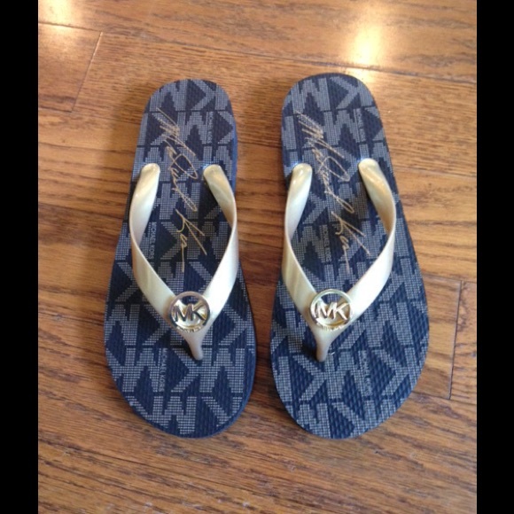 Michael Kors gold flip flops