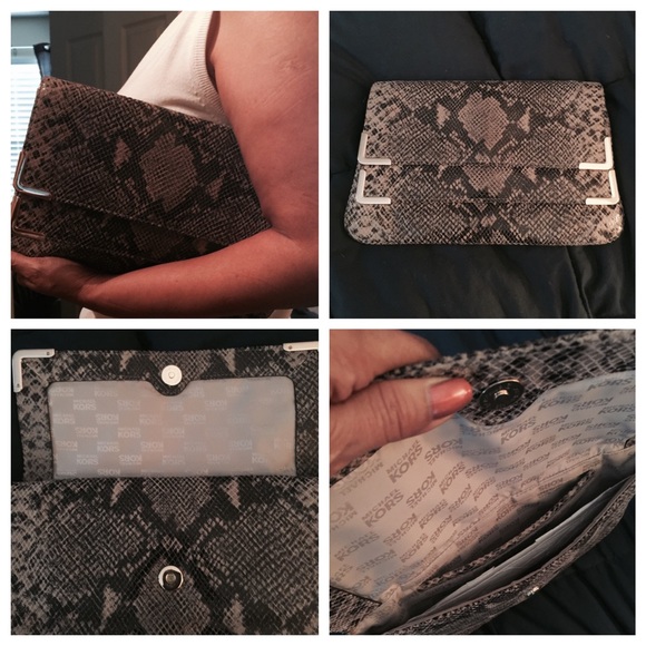 Authentic Michael Kors Brown clutch.