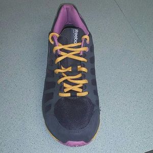 Charcoal grey, purple, and yellow reebock shoes