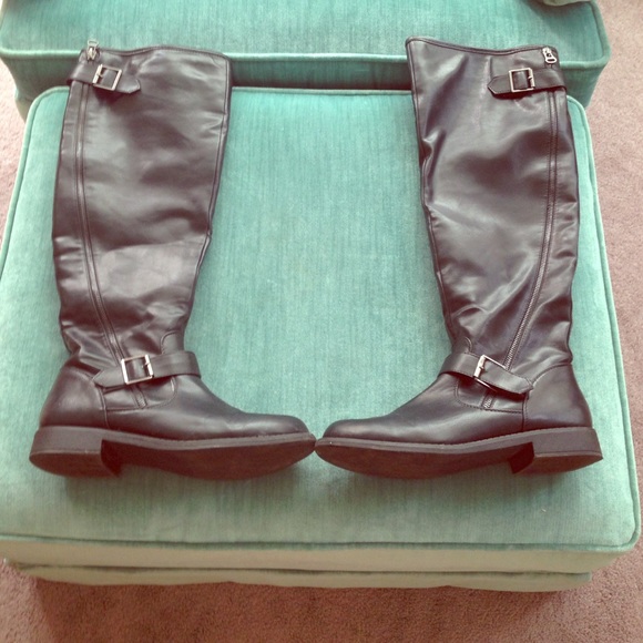 Above the knee, black riding boots