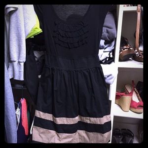 Fitted at bust & flowing at midsection.