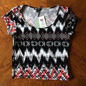 Pink, black, and white Aztec crop top.