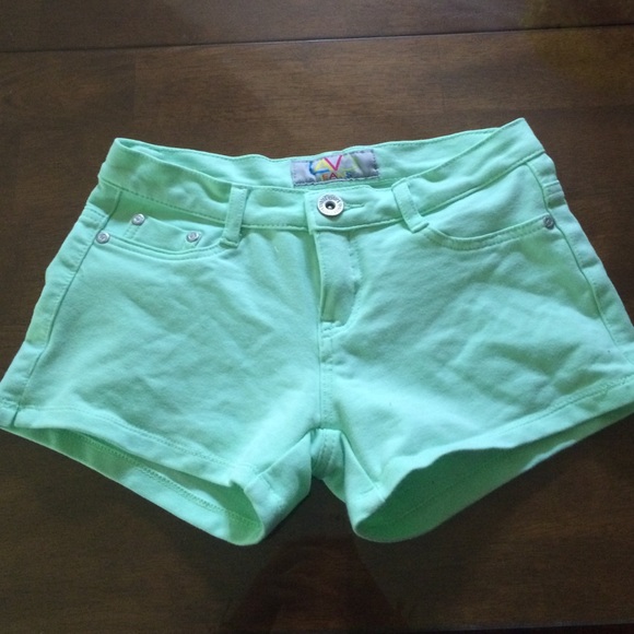 Mint green shorts.