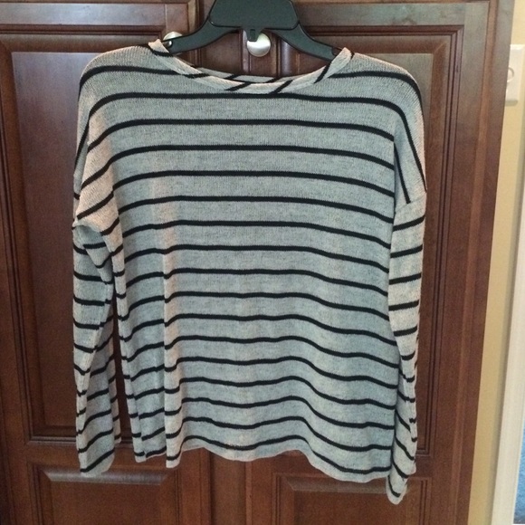 Long sleeved, striped shirt.
