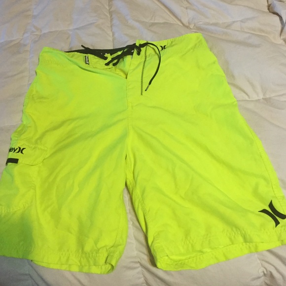 Neon yellow Hurley swim trunks / board shorts