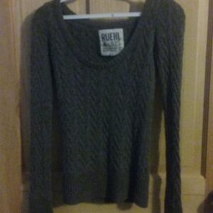 Gray knit sweater.