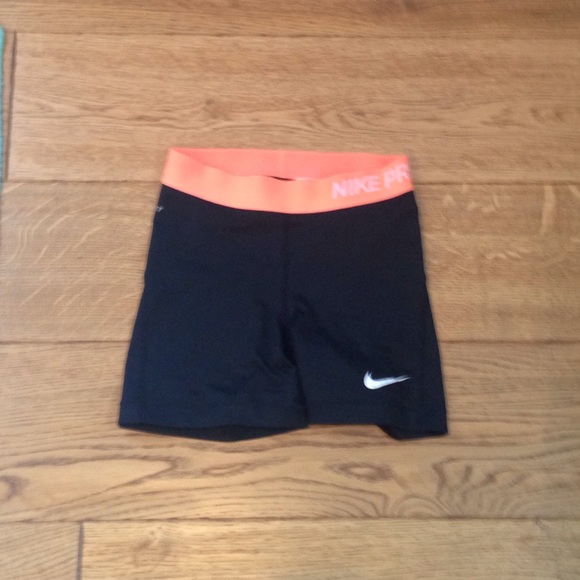 Black with orange band Nike pros