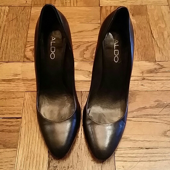 Black leather shoes by Aldo