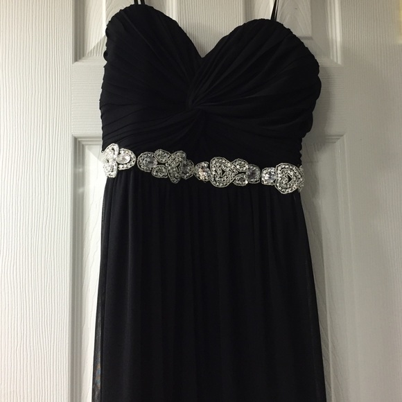 Strapless dress with ruched bust and beading.