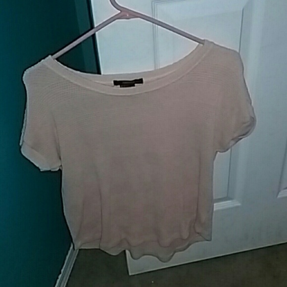 Light pink colored shirt.