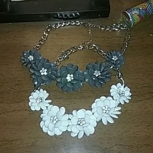 2 flower necklaces.