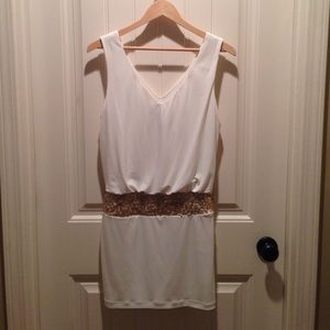 Cream color with gold sequin detail.