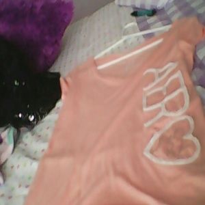 A Aeropostale shirt (peach/pink).