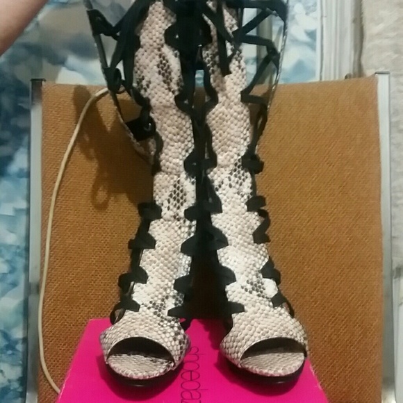 A pair of Sexy knee high open toed heels