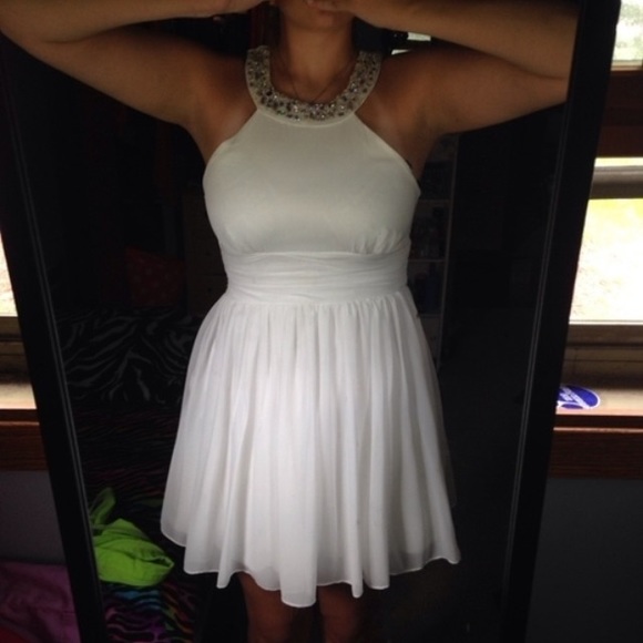 Sleeve less white dress, see threw in back.