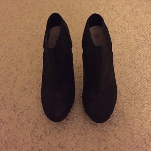 Black booties with red heel