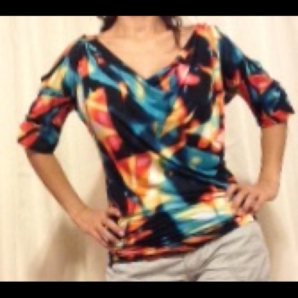 Tropical top with sexy cut out shoulders.