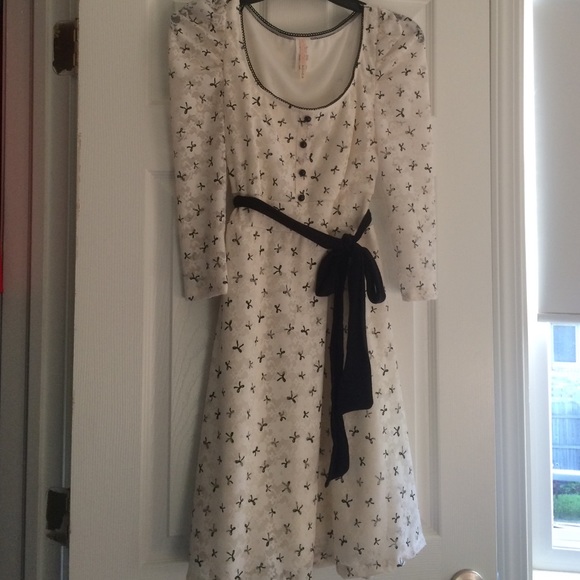 Ivory lace dress with black bow print
