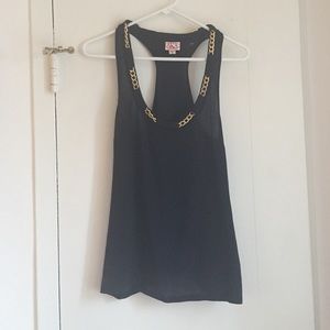 Black tank with gold chain detail around neck