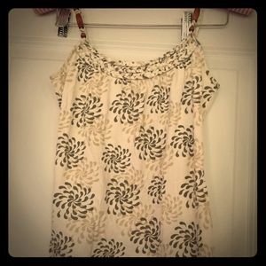 Cream tank with wooden beads on straps.