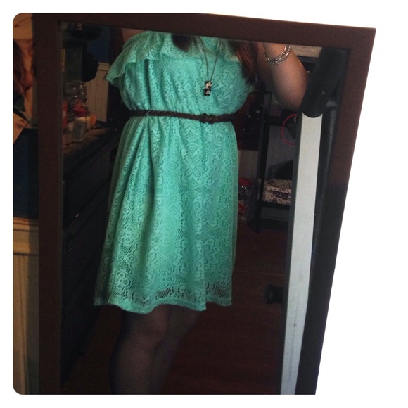 Blue strapless dress, with a brown braided belt.