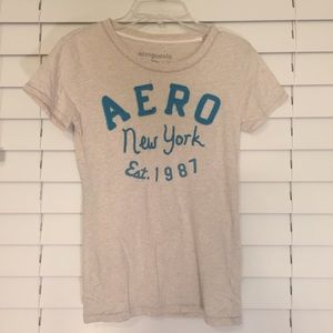 Off white and teal graphic Tee