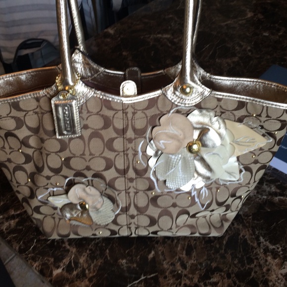 Gold and brown floral embellished Coach handbag