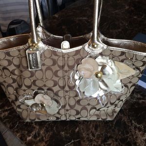 Gold and brown floral embellished Coach handbag