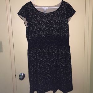 Cute black dress with an beige background