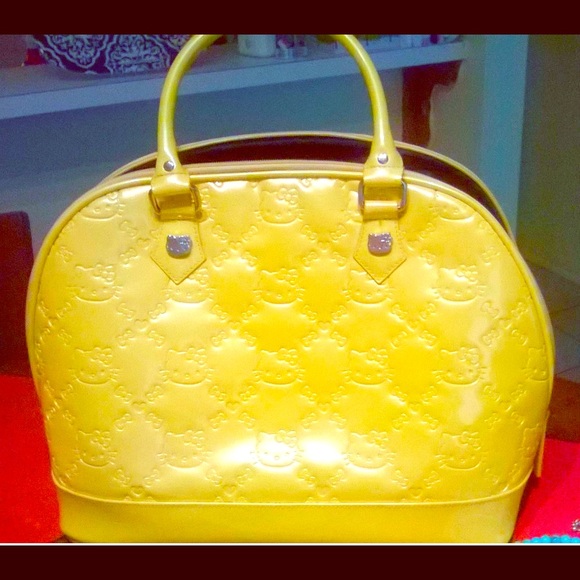 Bright yellow embossed Hello Kitty purse NWOT!!!
