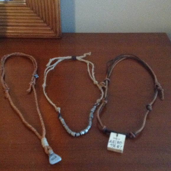 Set of three young  men necklace.