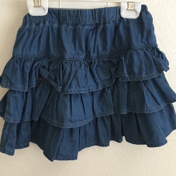 Child size blue denim styled skirt.