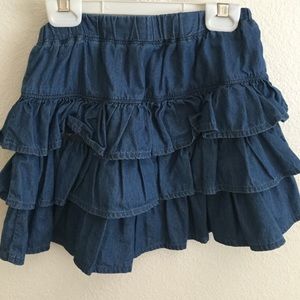 Child size blue denim styled skirt.