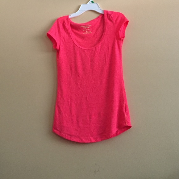 bright orange scoopneck top