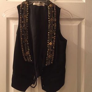 Black vest with gold detail